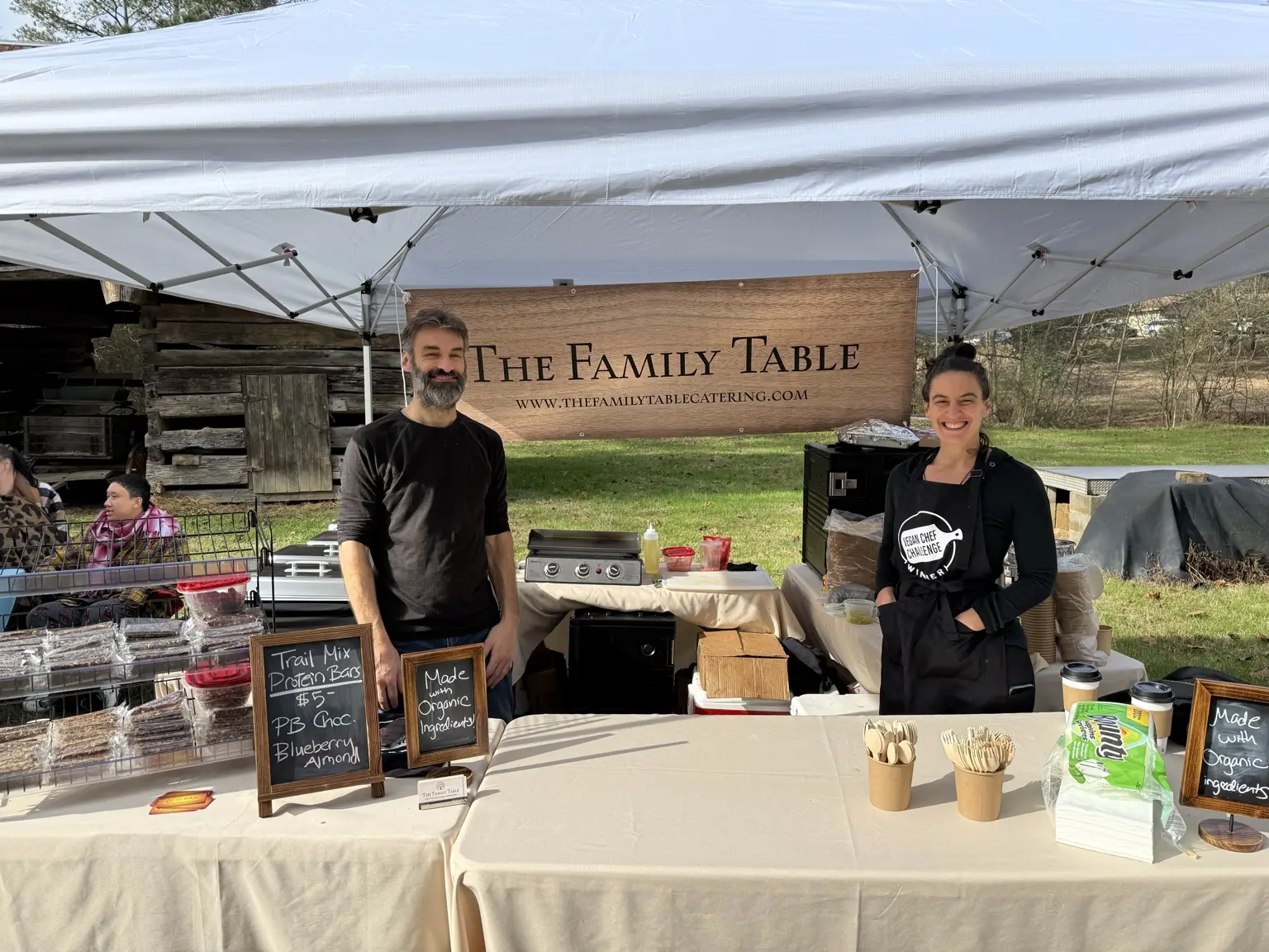 Gaetano and Lauren together at their Family Table Catering booth